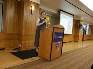 Charlie Rosgen speaking at a podium in the Alumni Reception Center