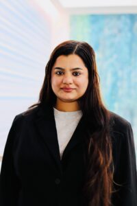 This is a headshot of Susmita Nanda LLM '26, wearing a black blazer and a white shirt.