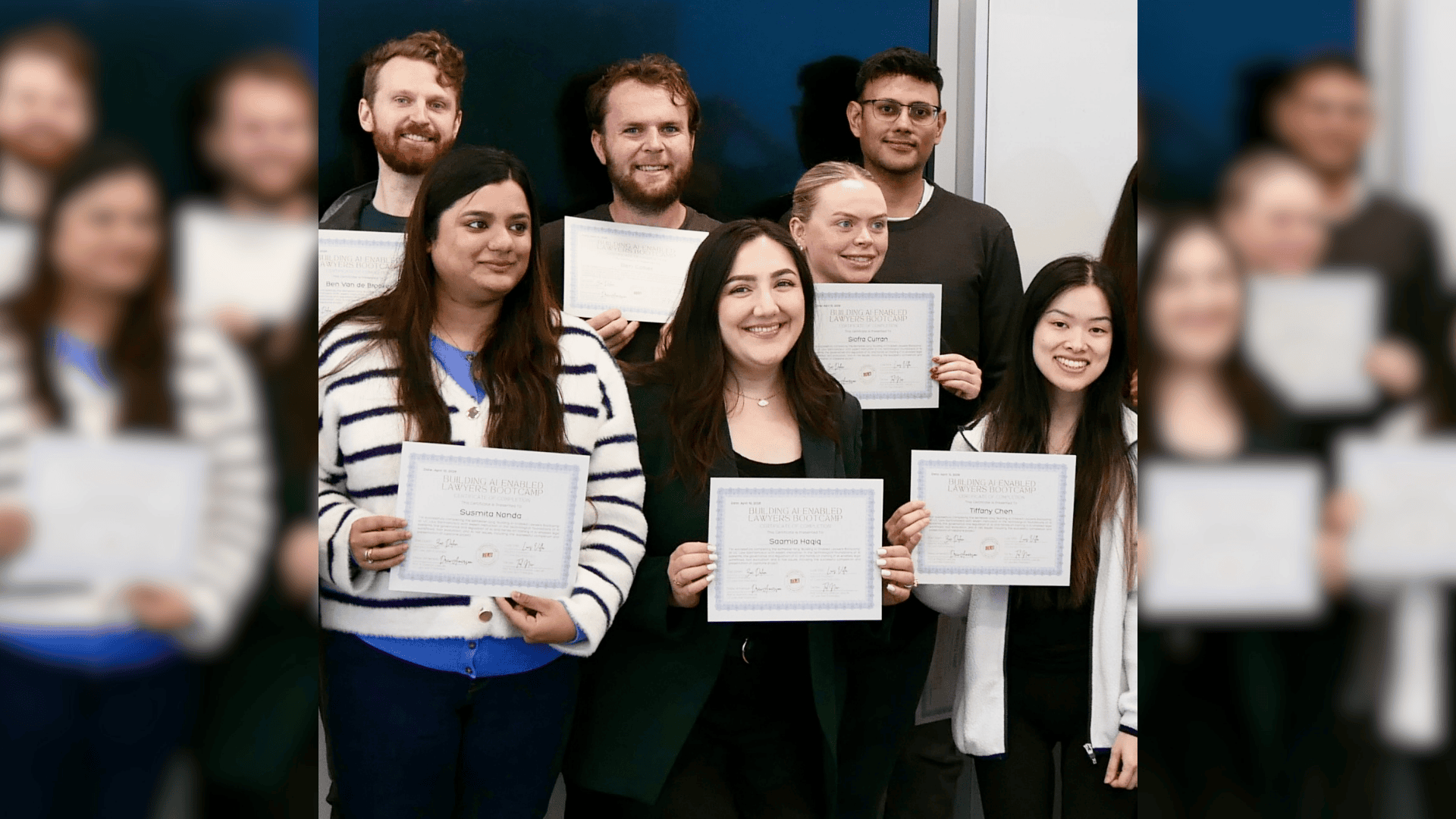 Students pose while holding their AI-Enabled Lawyering Bootcamp certificates of completion.