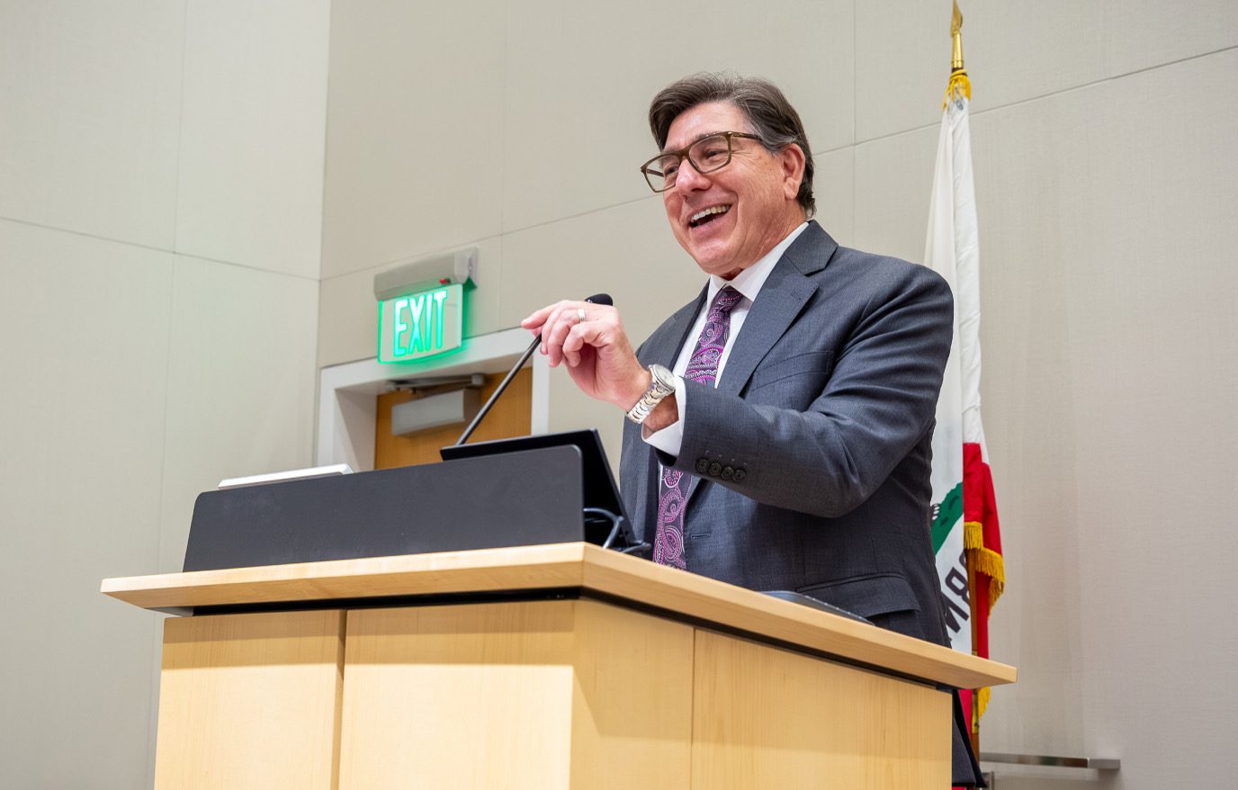 David L. Faigman speaking at a lectern