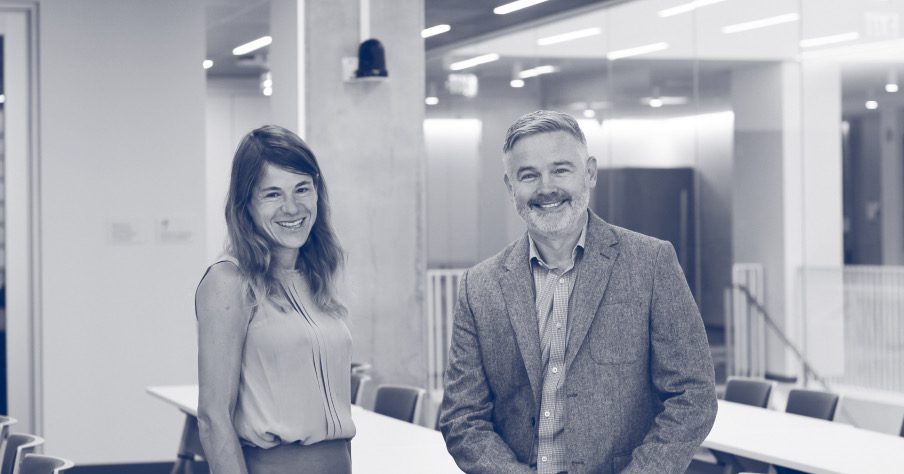 Two faculty members in the LexLab space